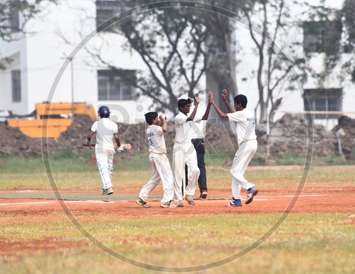 School kids celebrating during a cricket match