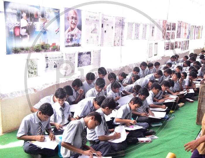 School kids drawing sketches during a competition