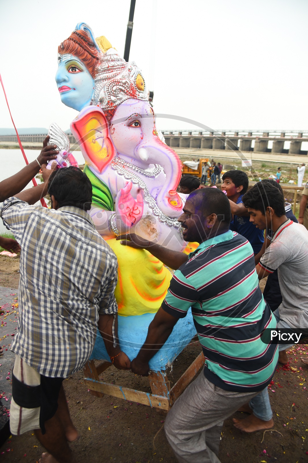 Men carrying the Lord Ganesha idol