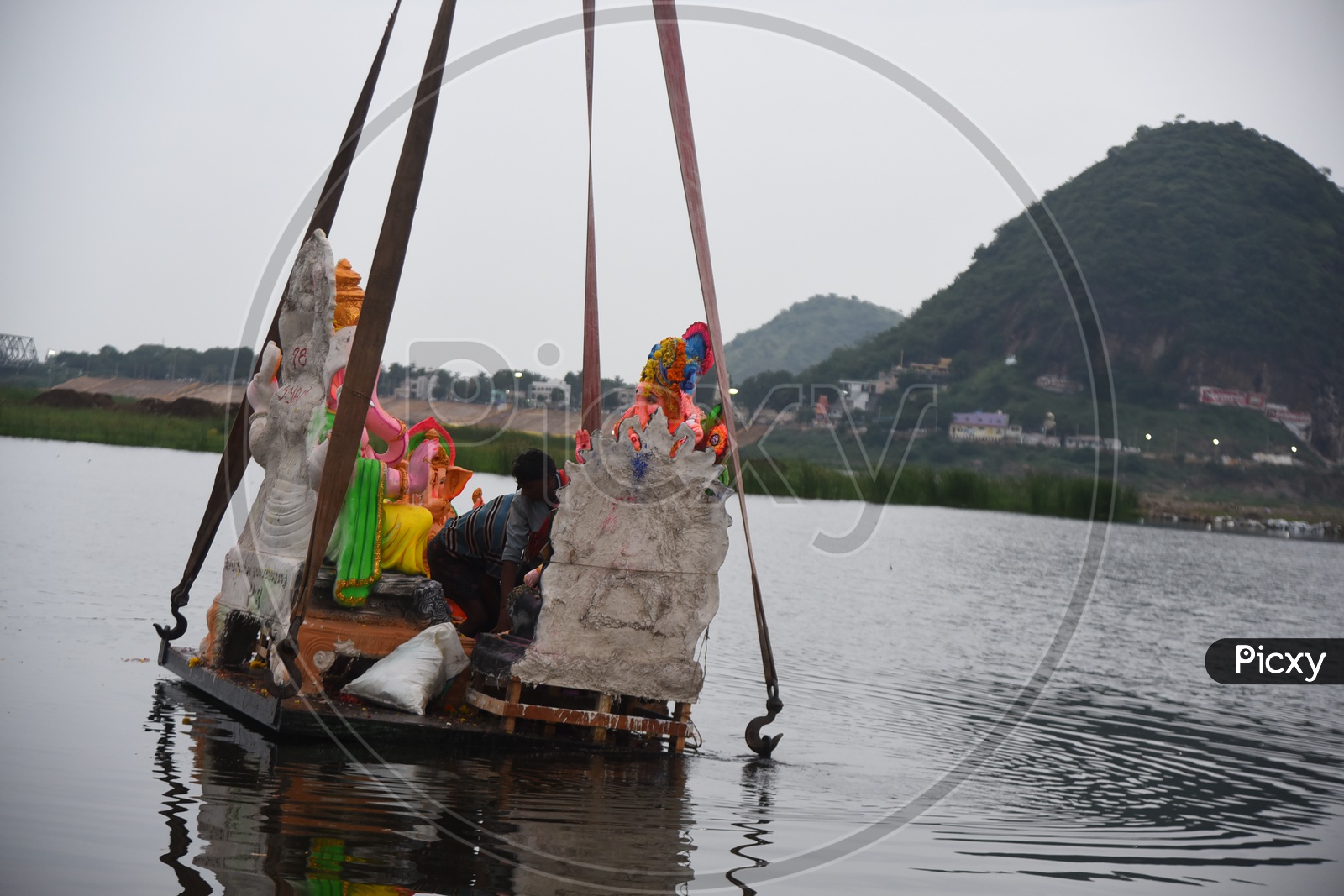 Ganesh Idols Being Immersed In Krishna River During Ganesh Visarjan
