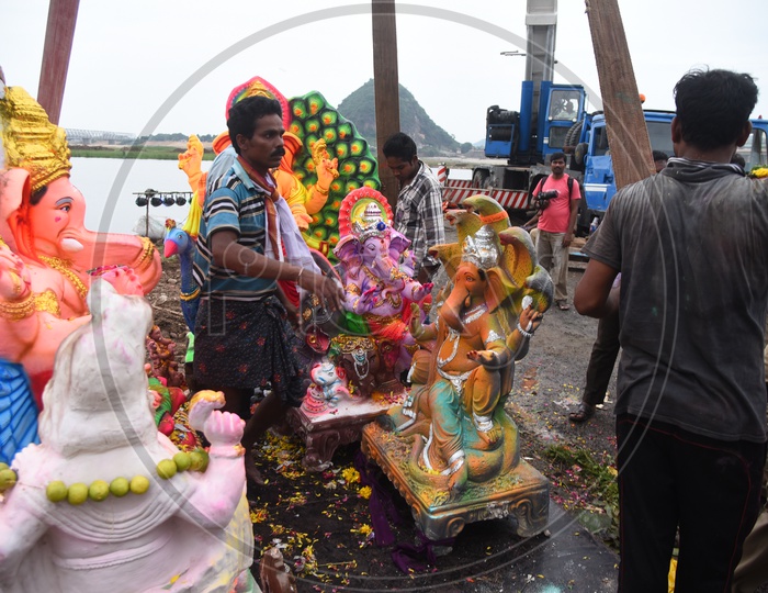 People preparing Ganesh Idol for the visarjan