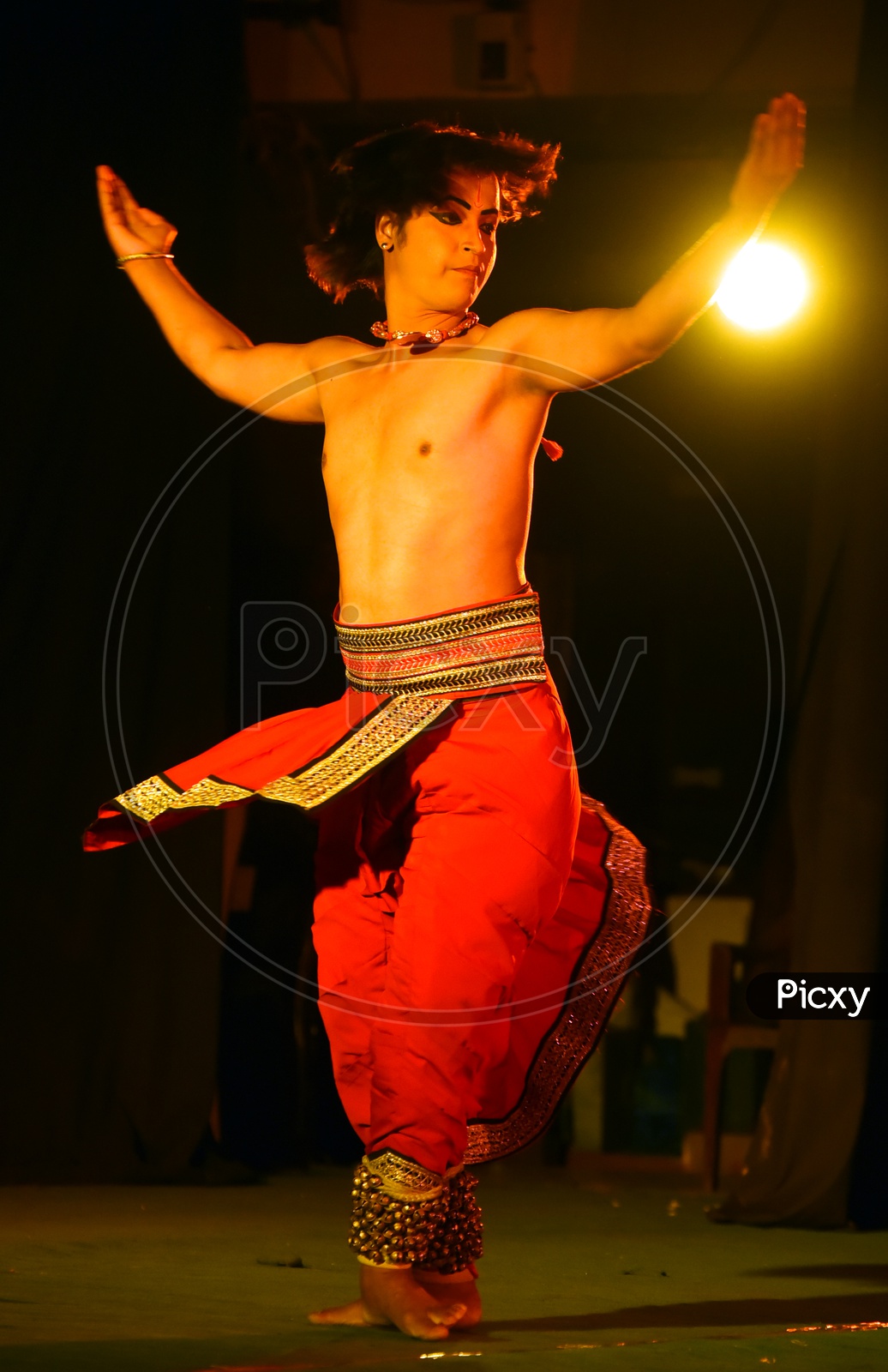 Artist performing Indian Classical Dance Kathak on stage