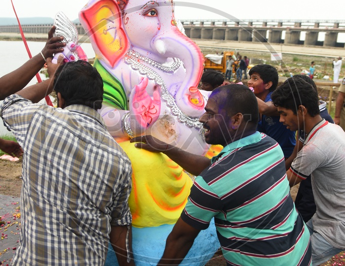 Men carrying the Lord Ganesha idol