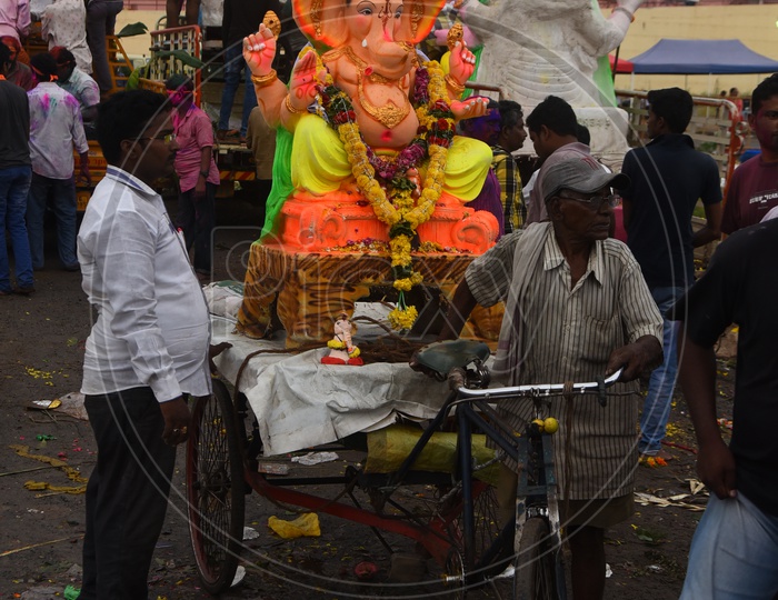 Ganesha Idols being carried on the rickshaw during Ganesh Visarjan