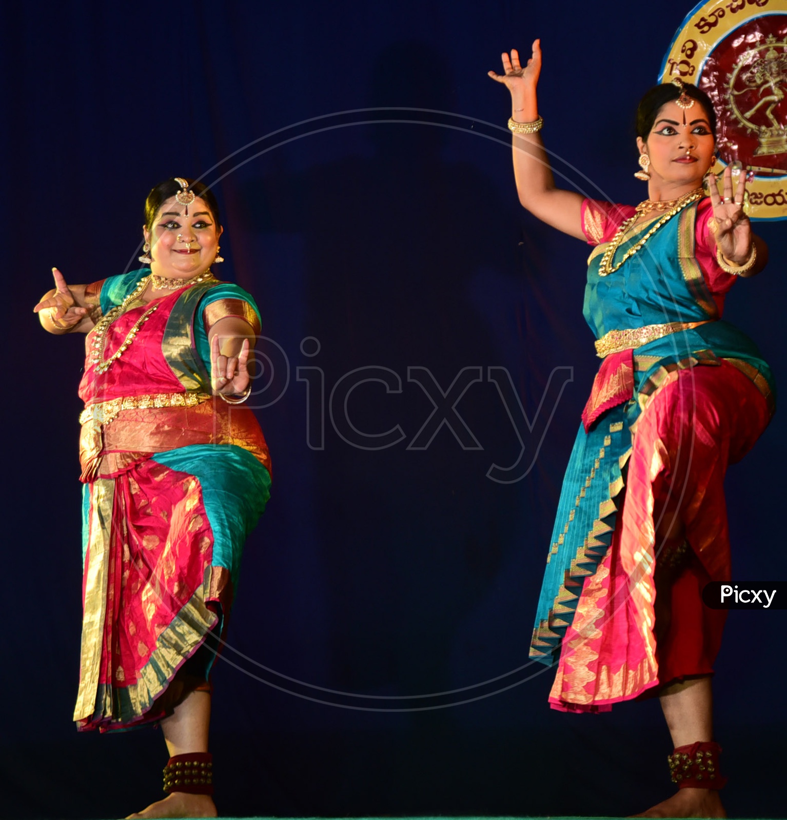 Artists performing Indian Classical Dance Kuchipudi on stage