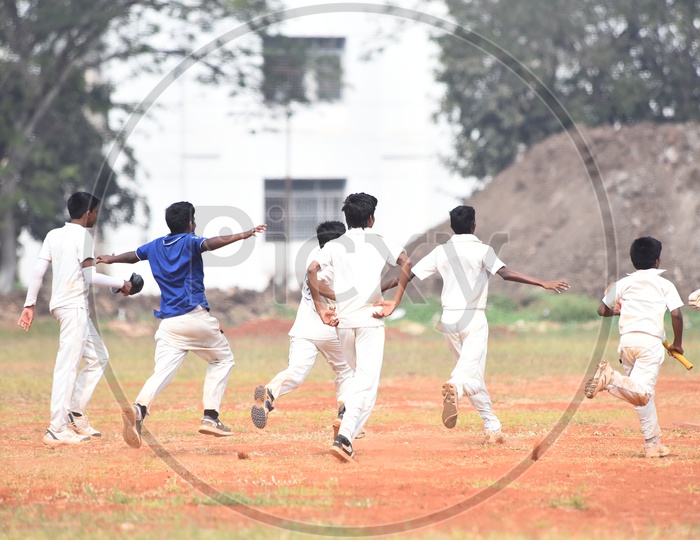 School cricket players celebrating