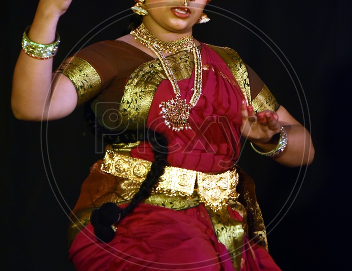 Artist performing Indian Classical Dance Kuchipudi on stage