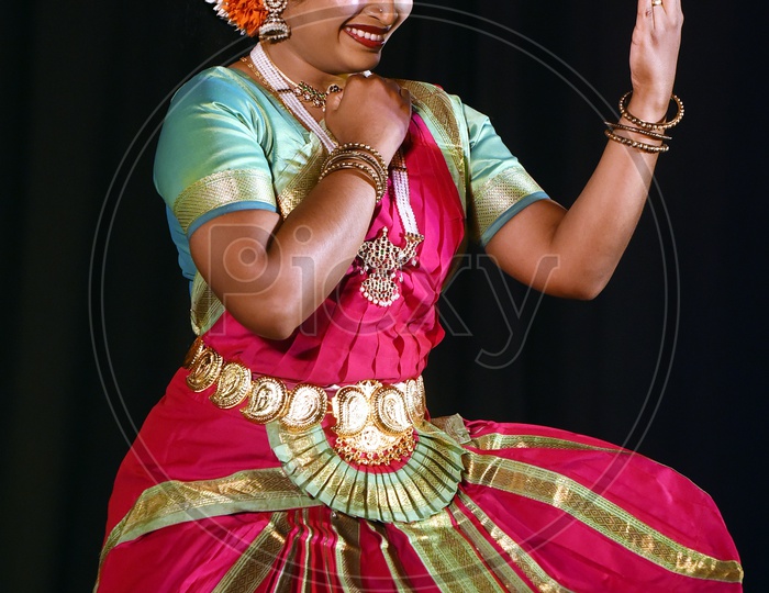 Artist performing Indian Classical Dance Kuchipudi on stage