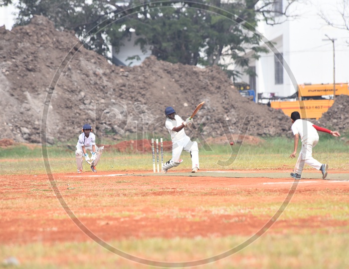 School kids playing cricket