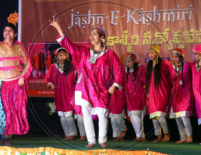 Artists performing Dogri dance on stage