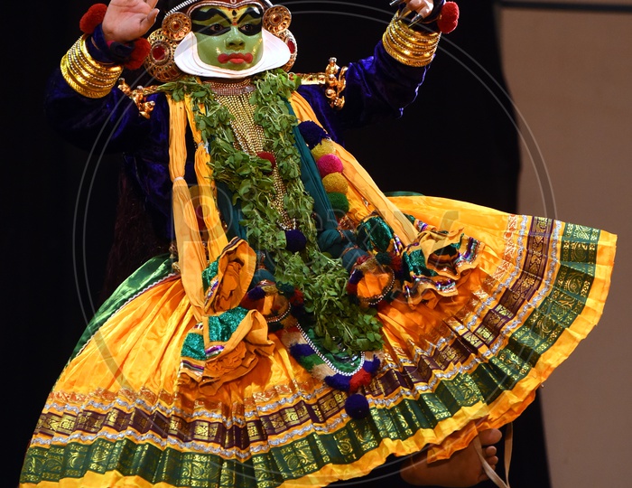 kathakali dancer performing on stage