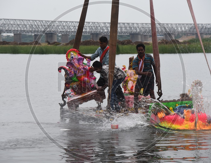 Ganesh Idols Being Immersed In Krishna River During Ganesh Visarjan