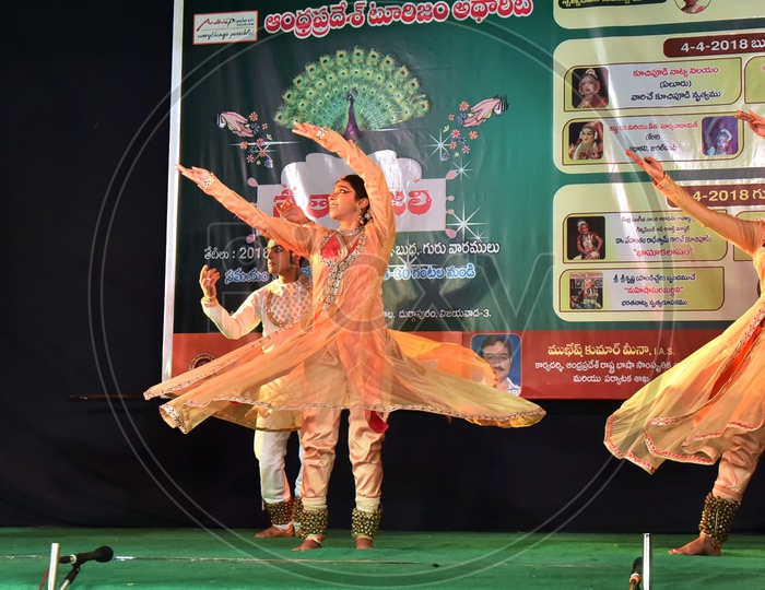 Artists performing Indian Classical Dance form Kathak on stage