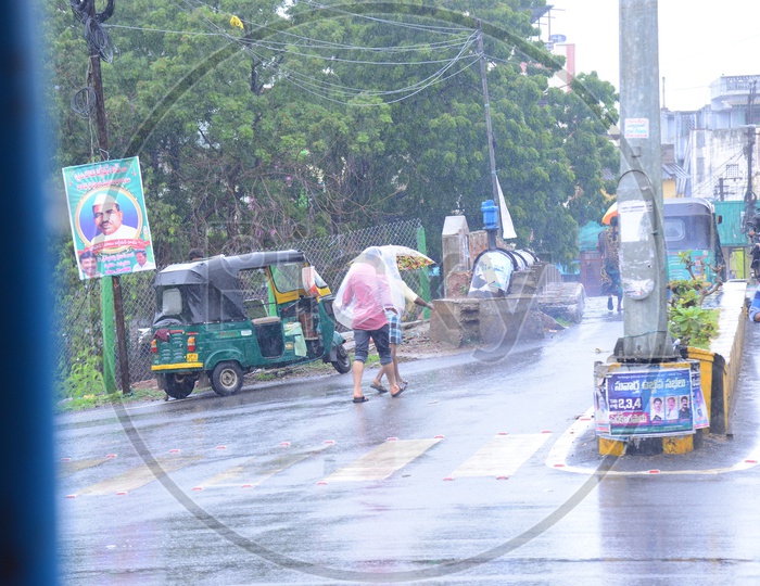 People moving on roads on a rainy day
