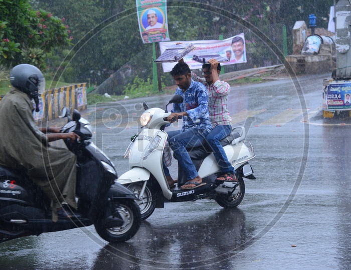 Bikers on the road while its raining