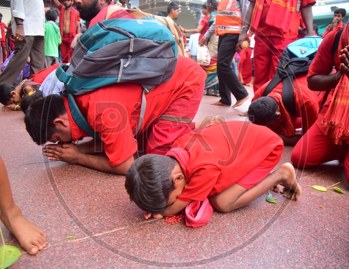 Devotees Wearing Bhavani Mala And Praying By Kneel Down