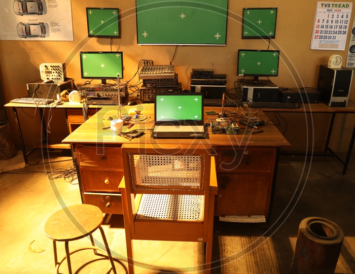 Screens with green mats in a room
