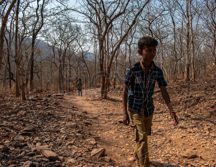 KID WALKING THROUGH THE HILL ROADS OF PAVANA NARASIMHA SWAMI TEMPLE, AHOBILAM.