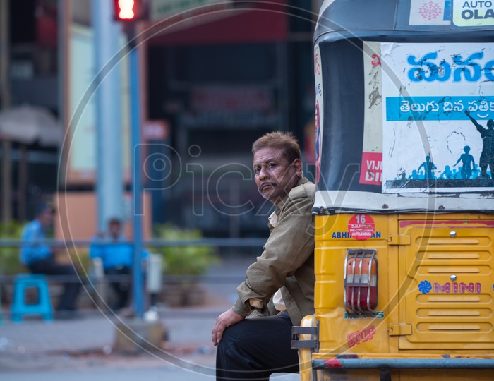 An Auto Driver with His Auto