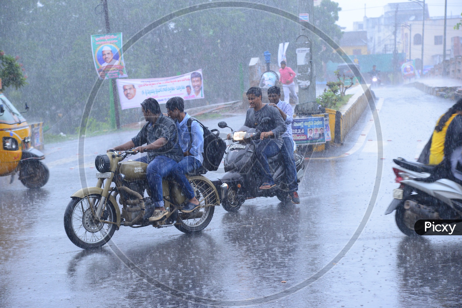 Bikers on the road while its raining