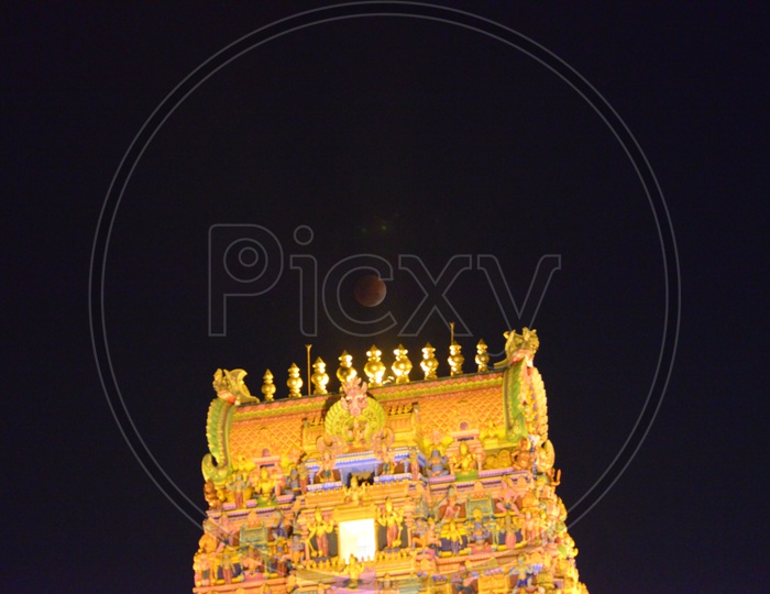 Moon  Lunar Eclipse Over Hindu  Temple Shrine