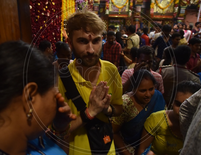 A Foreigner Devotee In Darshan Queue  Line