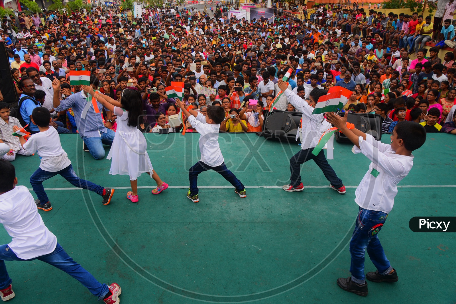 School Children Dancing On Stage
