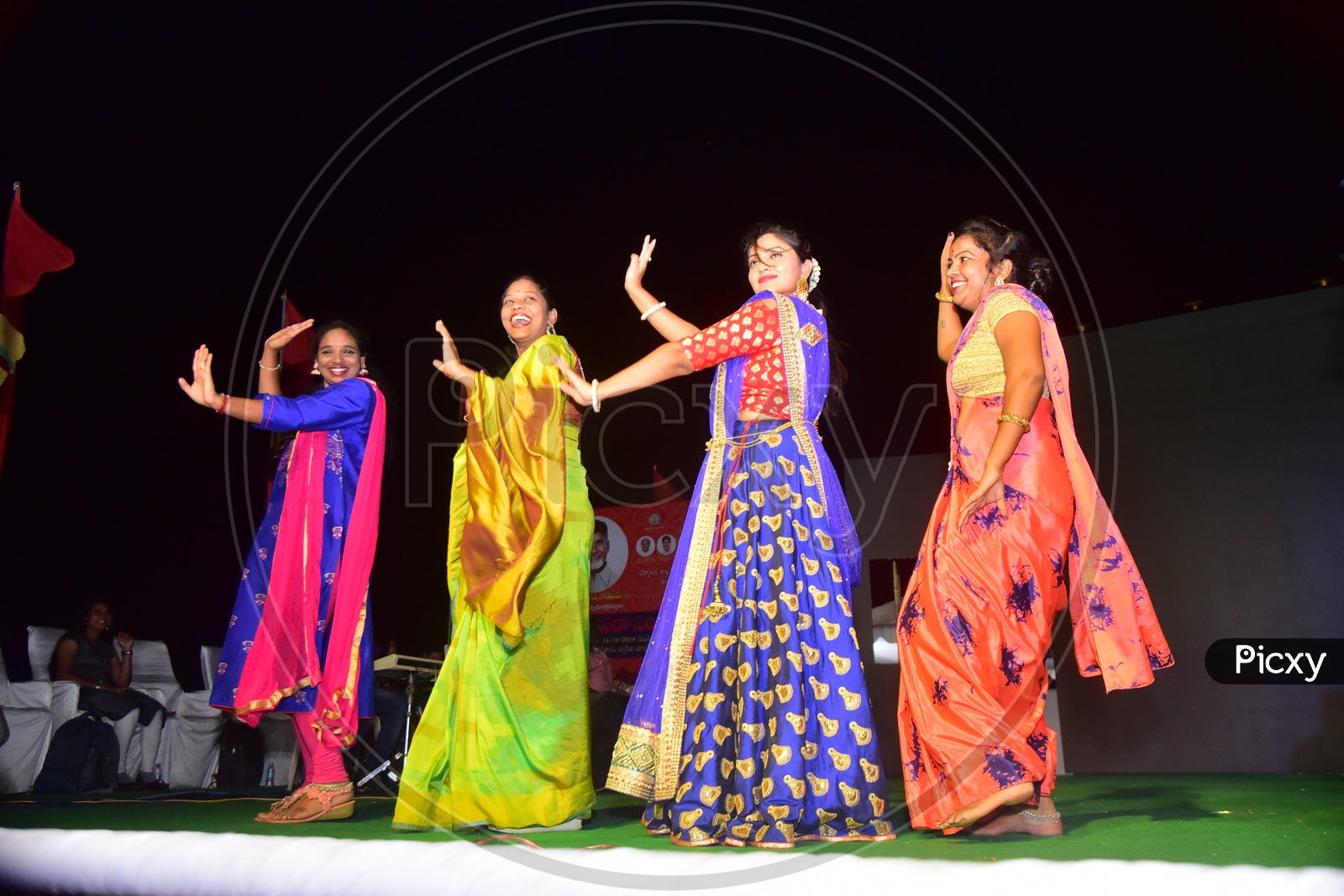 Ladies Dancing On Stage In an Event