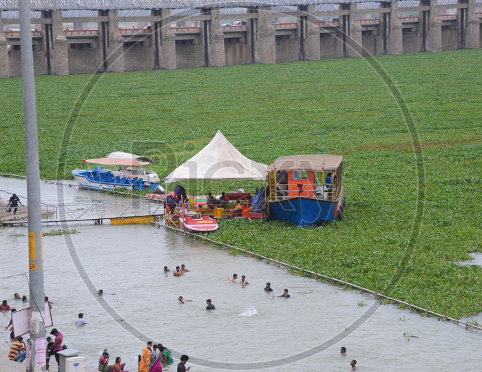 People Bathing In Krishna River Waters At Ghats in Vijayawada