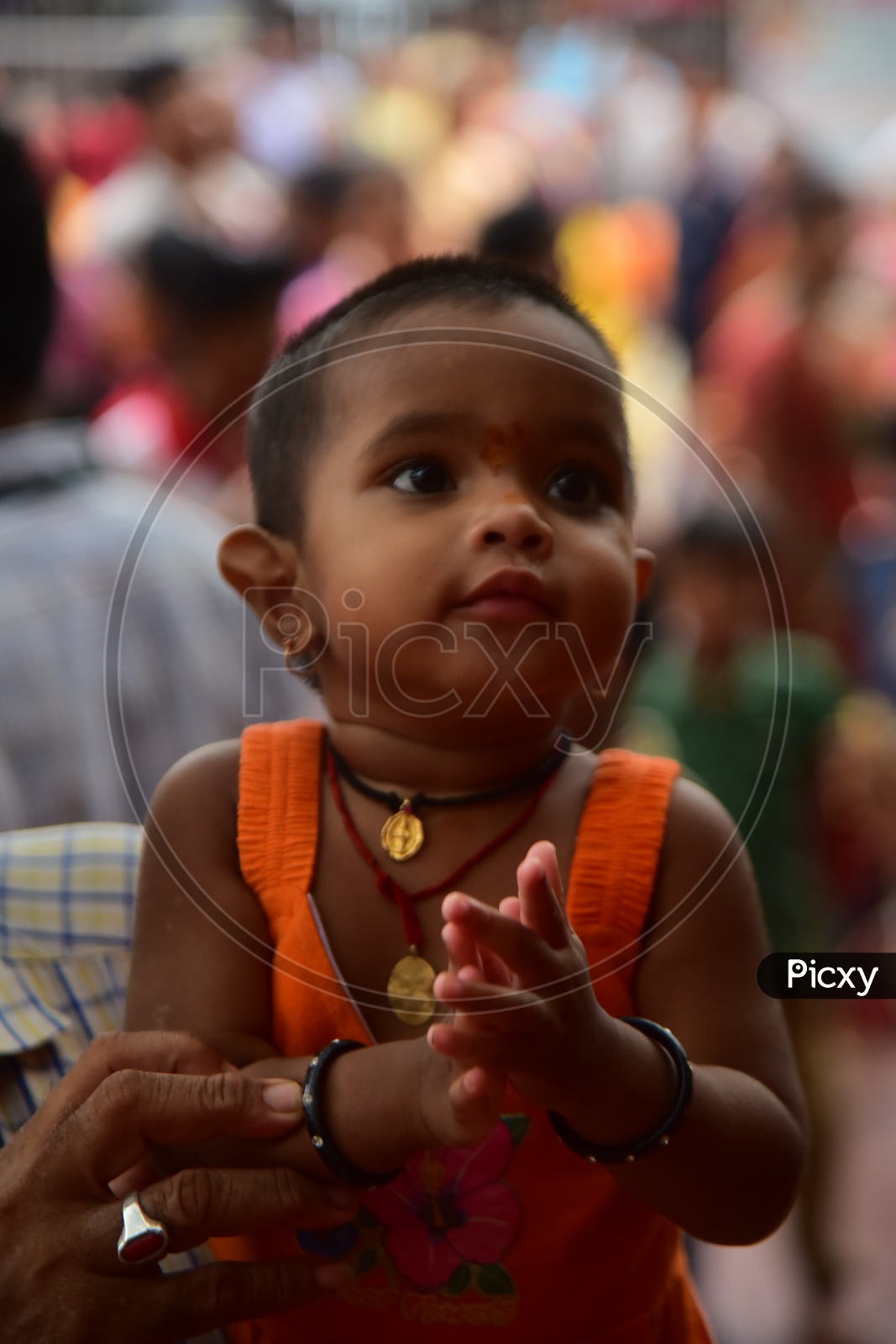 A Father With His Child In Queue Line for Darshan