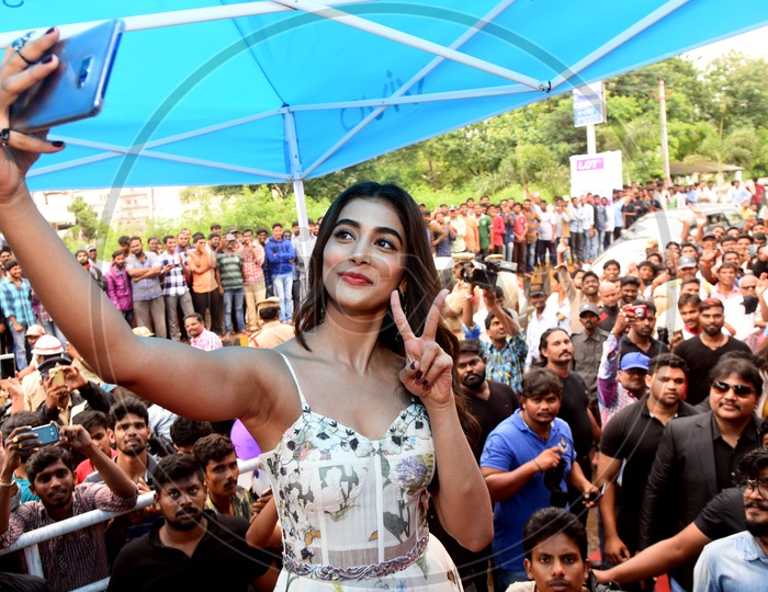 Actress Pooja Hegde Taking Selfies With Crowd