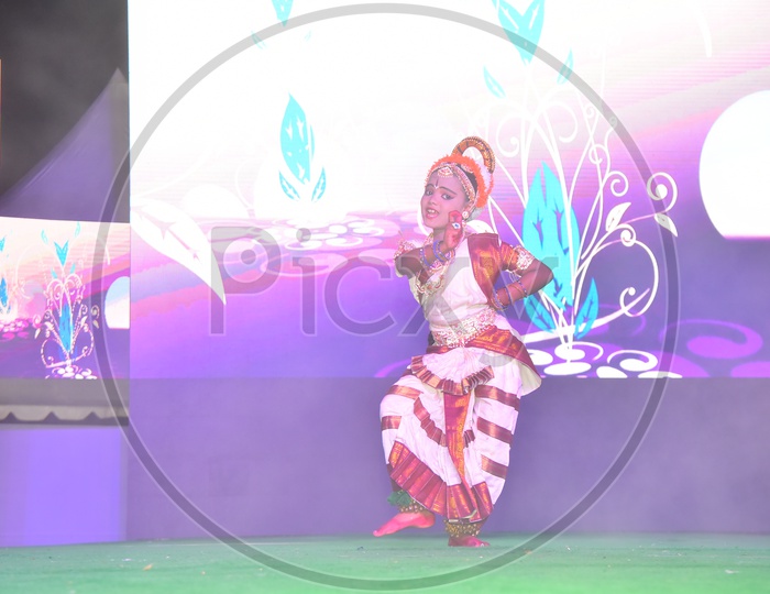 A Girl Performing Kuchupudi Dance On Stage