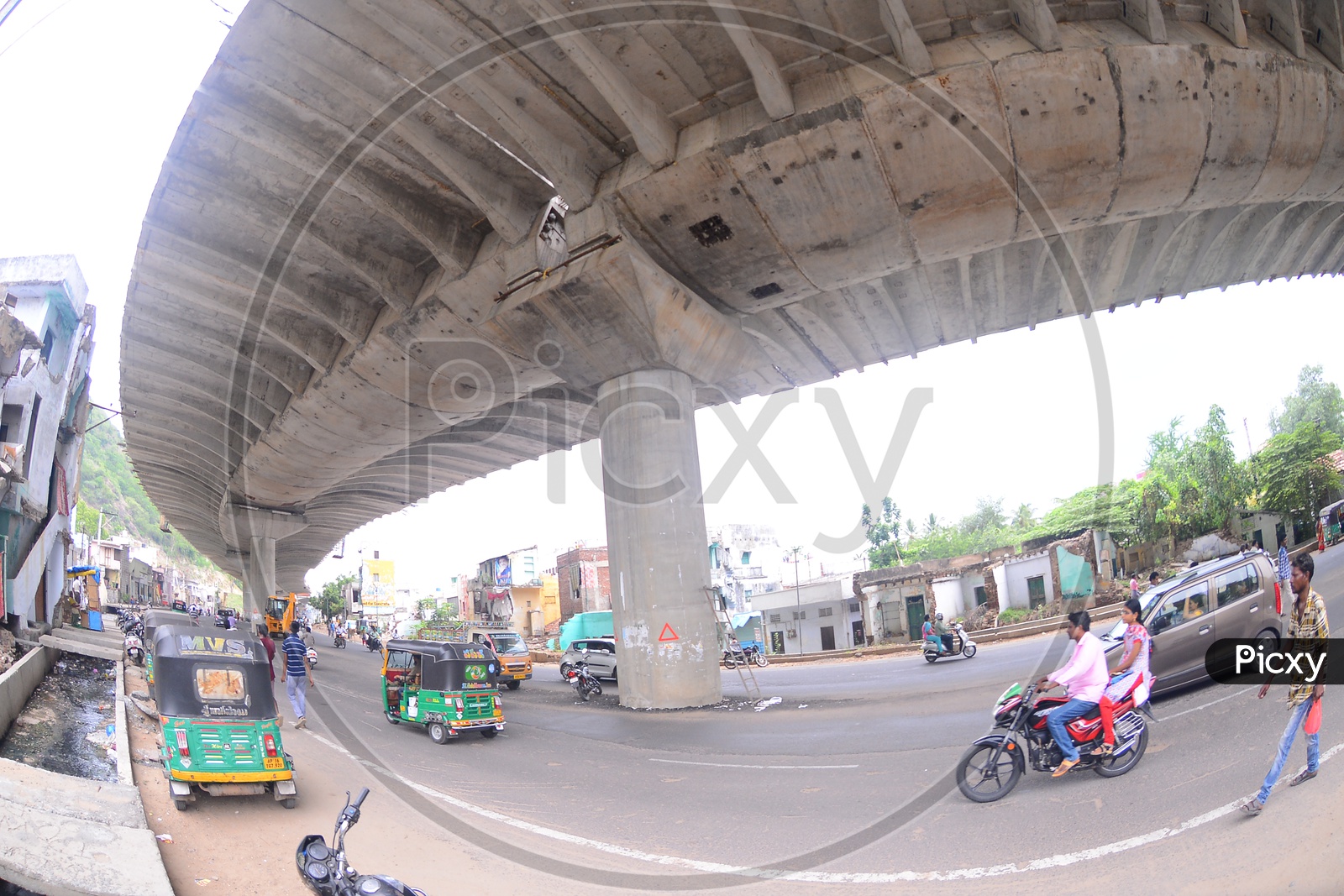 A View Of a Flyover With Vehicles Commuting On Roads Under The Flyover