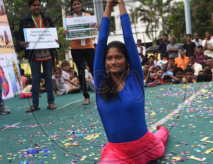 A Young School Girl Performing Yoga Aasanas  on Stage