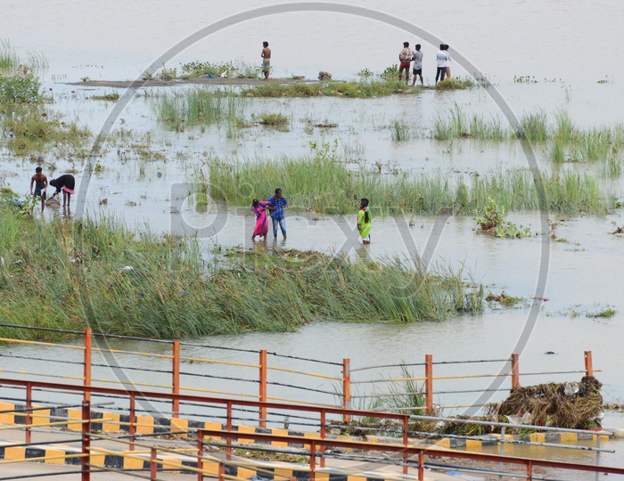 People at the river bank of Krishna river
