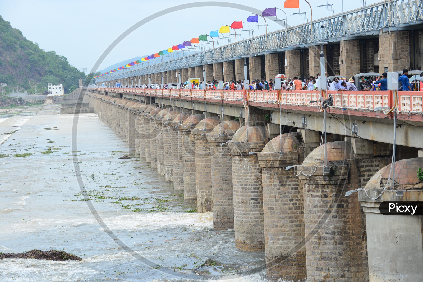 People and traffic on Prakasam barrage over Krishna river in Vijayawada