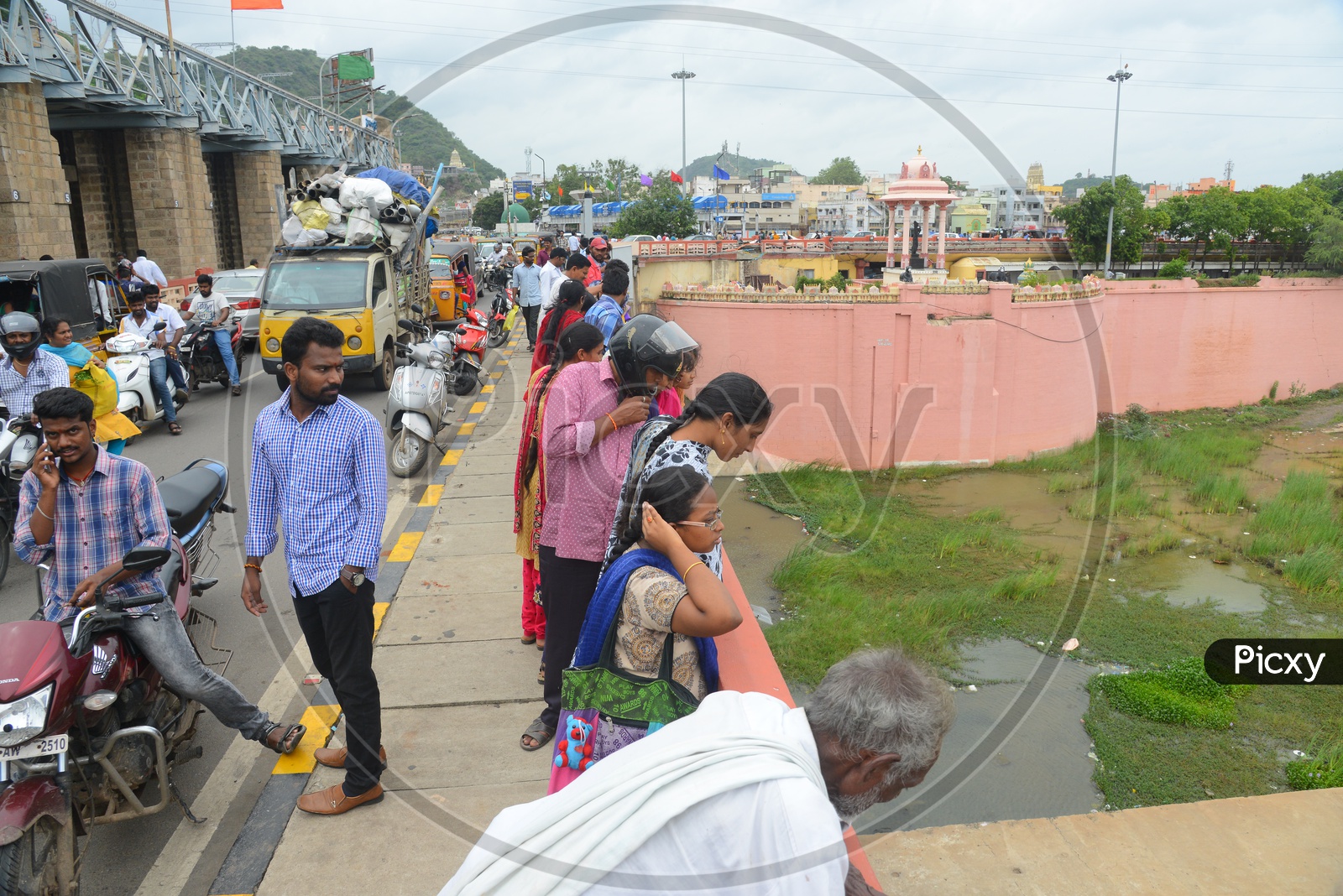People and traffic on Prakasam barrage over Krishna river in Vijayawada