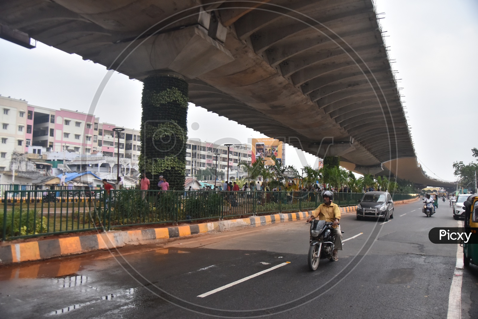 Commuting Vehicles  Under  Flyover Bridge