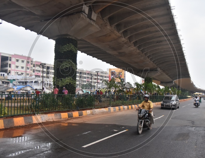 Commuting Vehicles  Under  Flyover Bridge
