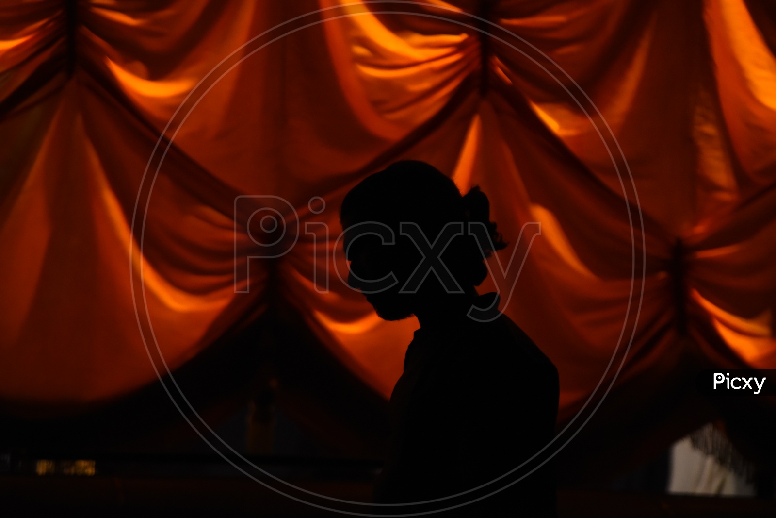 Silhouette of a woman with a red background