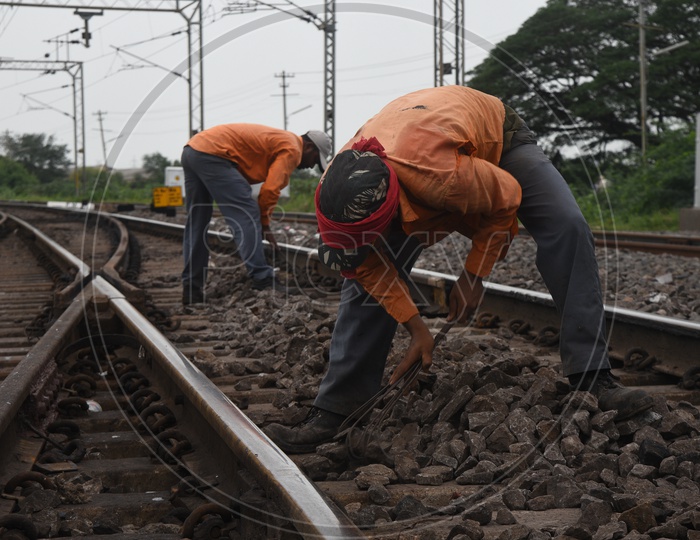 Track men working near the railway tracks