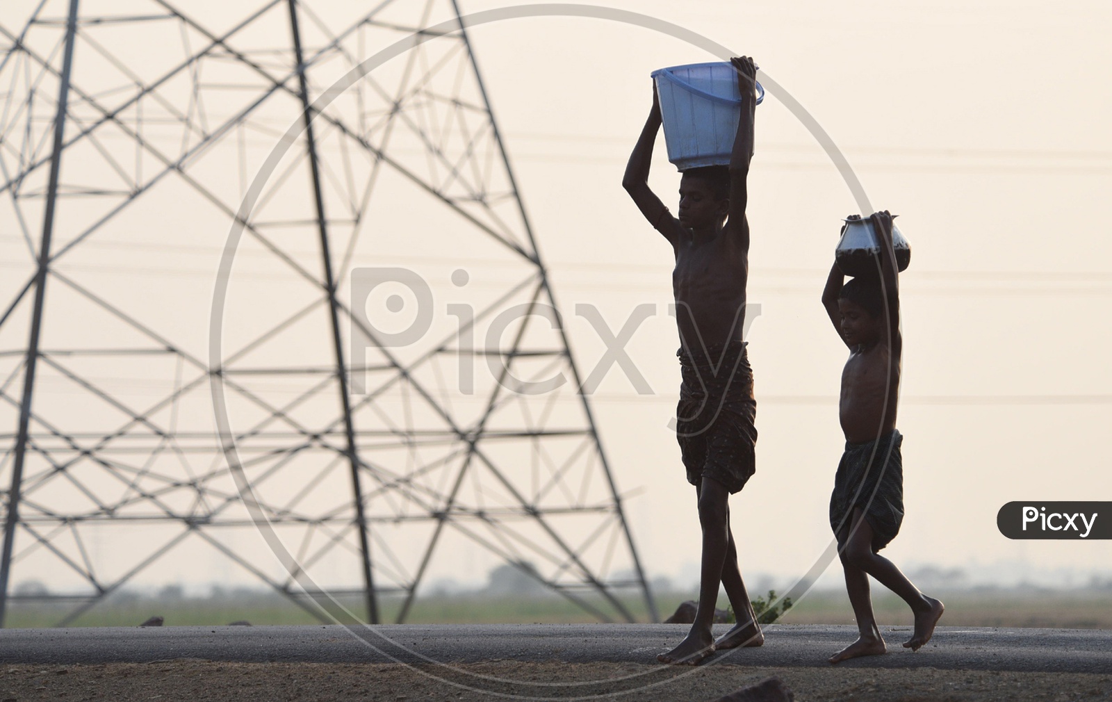 Rural kids carrying water