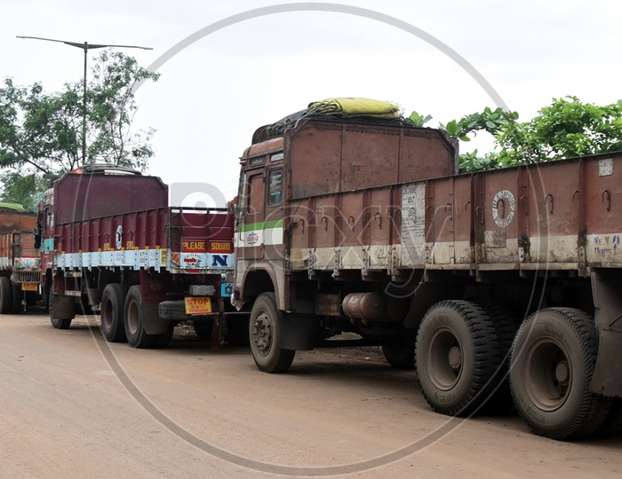 Heavy Transport Vehicles Or Lorries Parked On Road Side