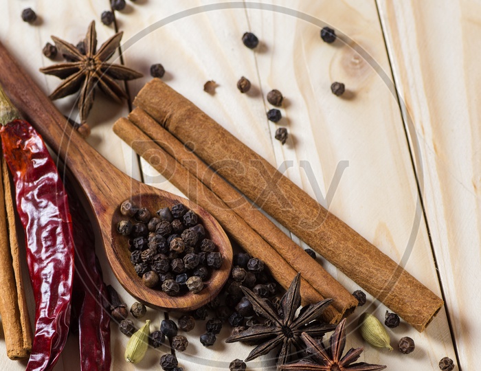 Cinnamon stick, Dried Red Chili, Star Anise, Cloves, Elachi, Black Pepper