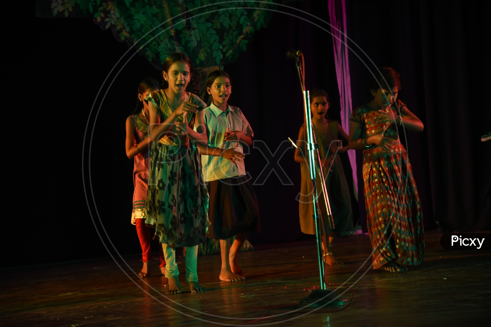 Girl children performing a dance on the stage