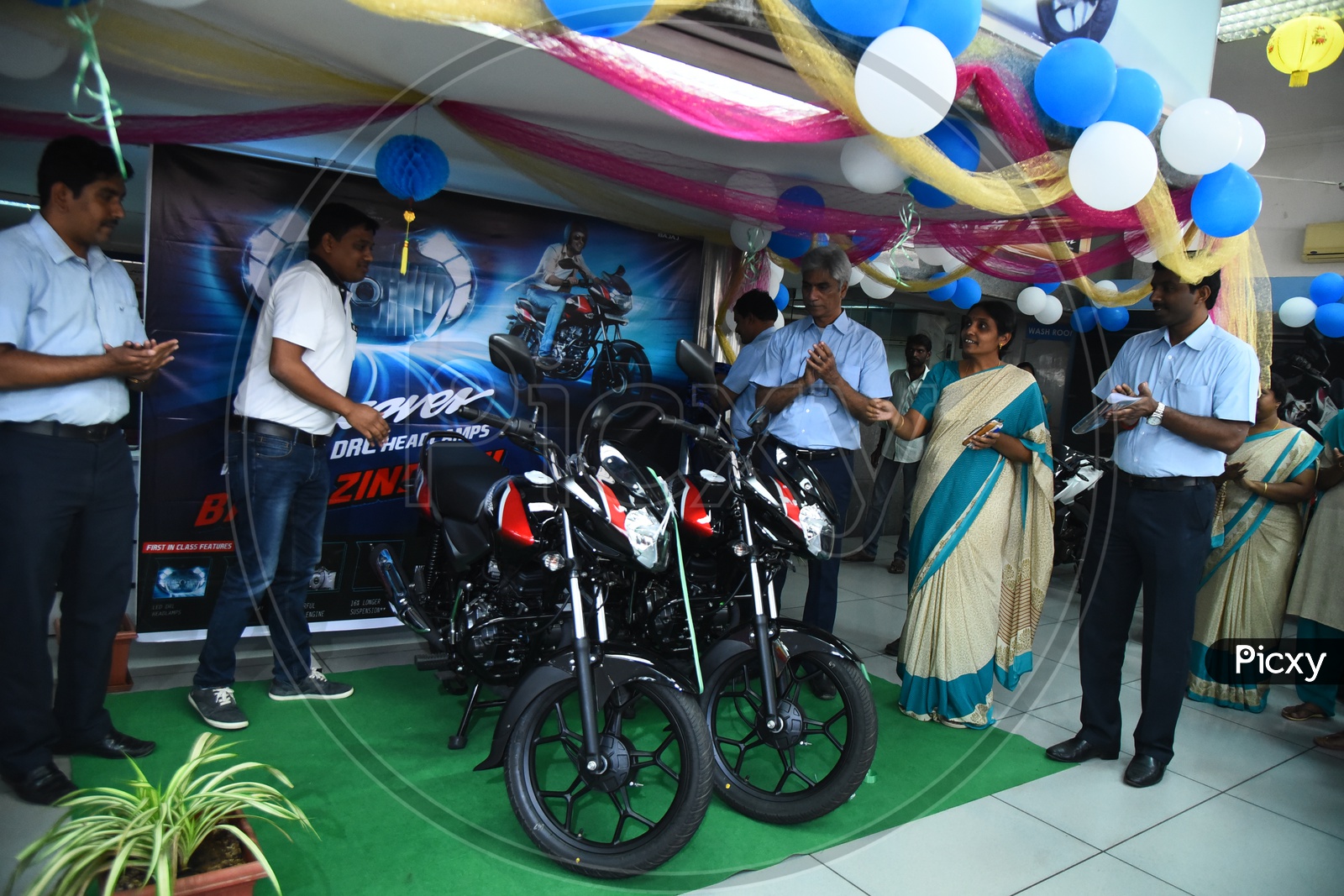 Staff during the launch of Bajaj Discover bike