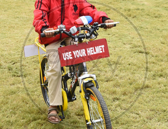 A Young Girl Promoting Use Your Helmet