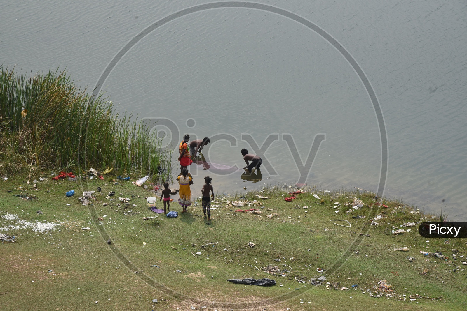 Rural people fishing by the river