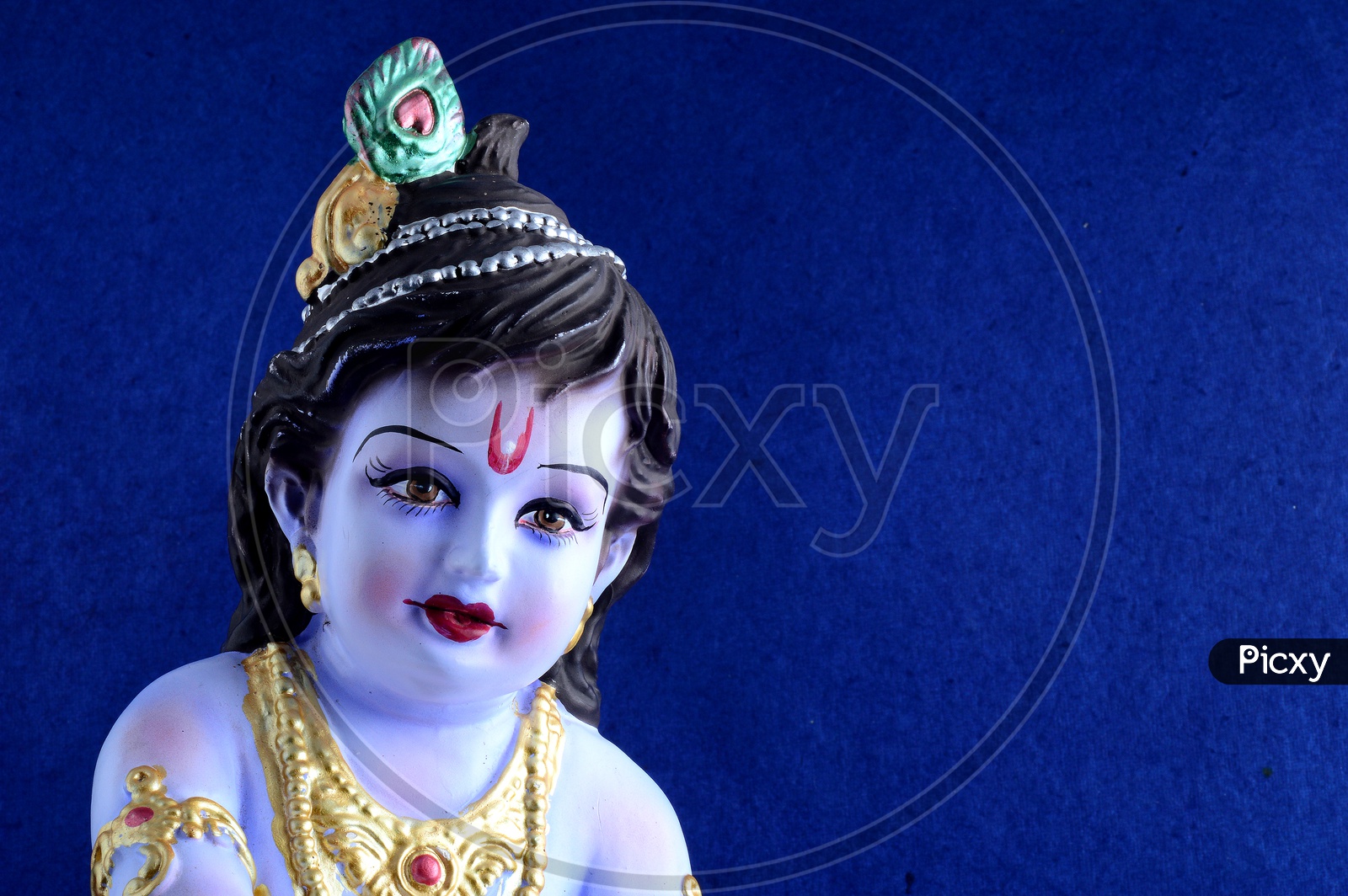 Image of Little Krishna Idol on dark blue background-HP830622-Picxy