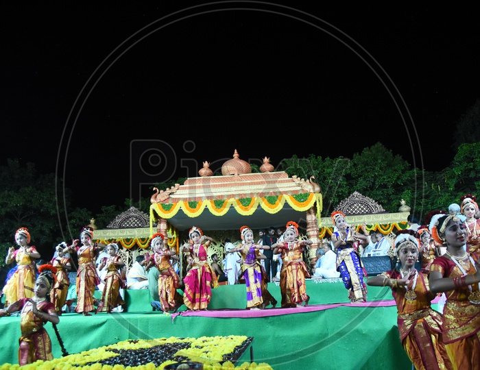 Students Performing Classical Dance On stage